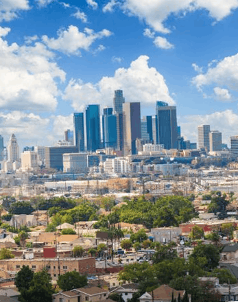 The downtown Los Angeles skyline above the surrounding neighborhoods